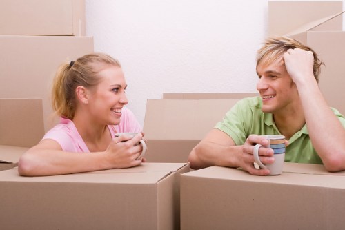 Loading furniture and boxes into a moving truck in Ilford