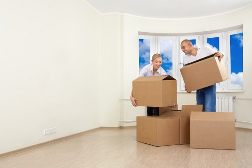Removal team handling boxes and furniture for an Ilford student move