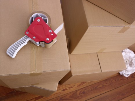 Careful loading of sofas, tables, and wardrobes for local transport
