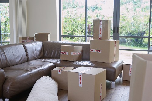 Packed boxes and furniture ready for collection during an Ilford move